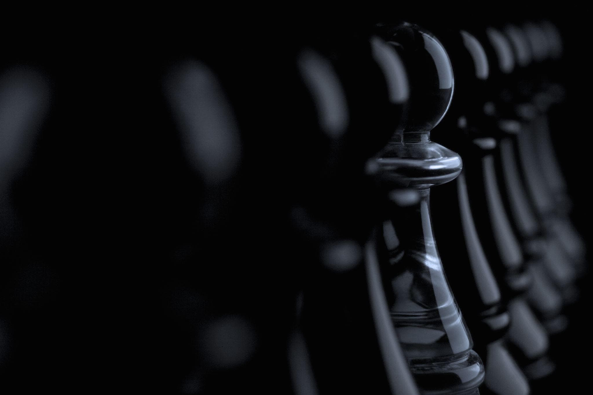 Chess pawn in dark setting